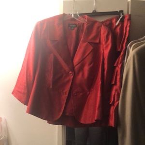 Dressy Plus size two piece red skirt suit. Sleeves are 3/4 length.